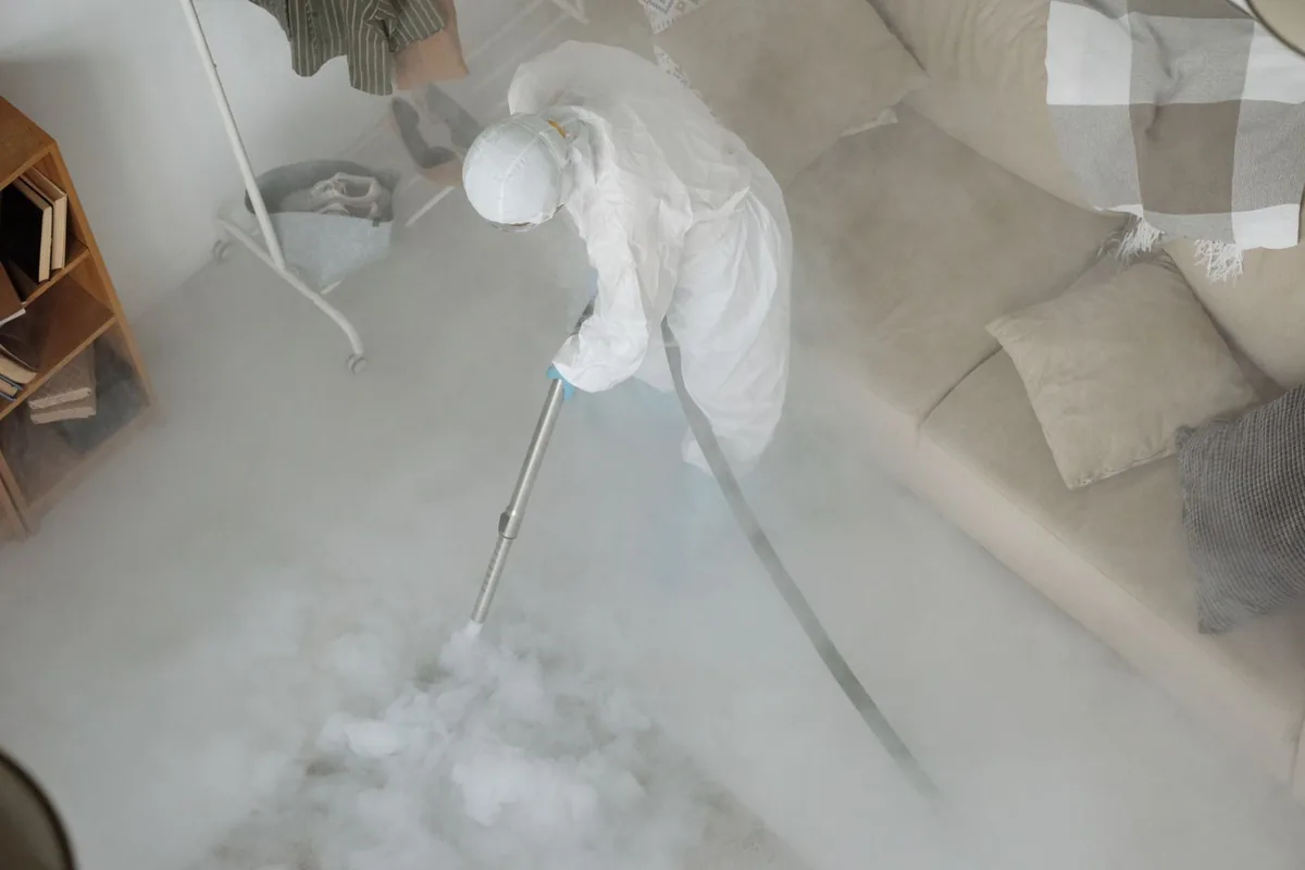 Biohazard cleanup technician in protective equipment, Longmeadow, MA